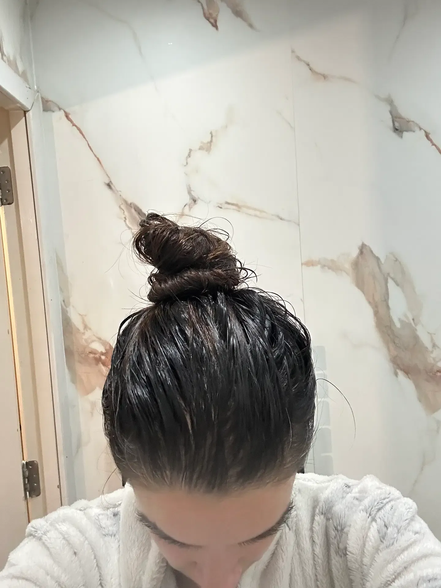 After: customer-submitted overhead photograph showing hair from behind